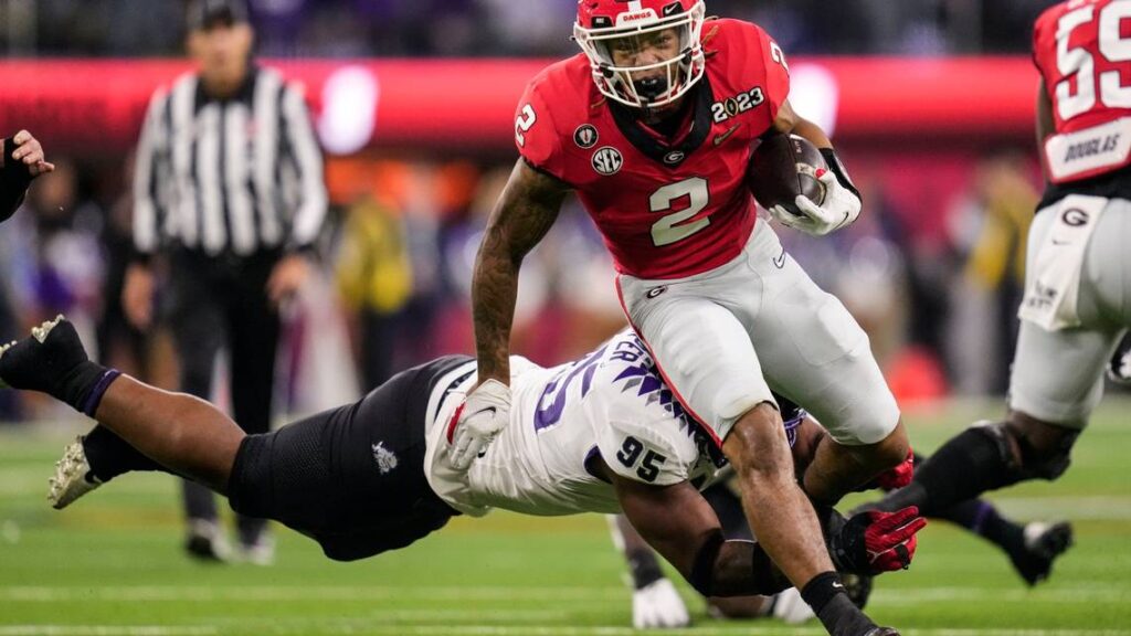 “Georgia Running Back Kendall Milton Showcases Skills at Georgia Pro Day in Payne Indoor Athletic Facility”