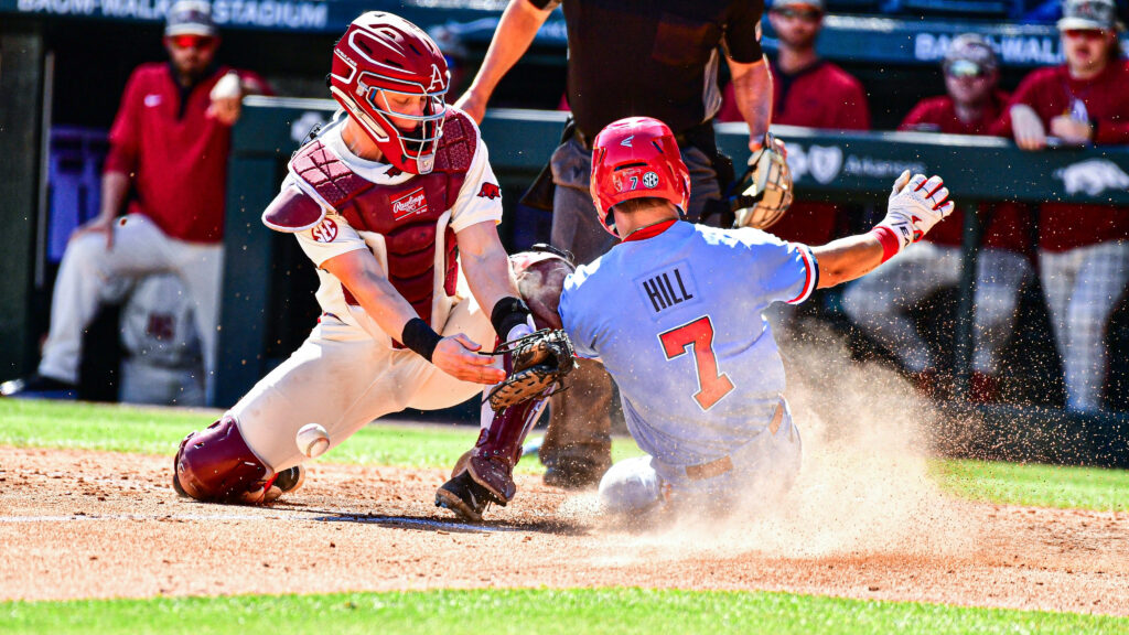 “Arkansas Takes Early Lead, Rebels Respond with Two RBI Singles”