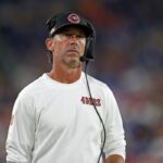 Breaking News: San Francisco 49ers veteran head coach Kyle Shanahan has been banned from the NFL and all sports activities following a heated dispute with management.